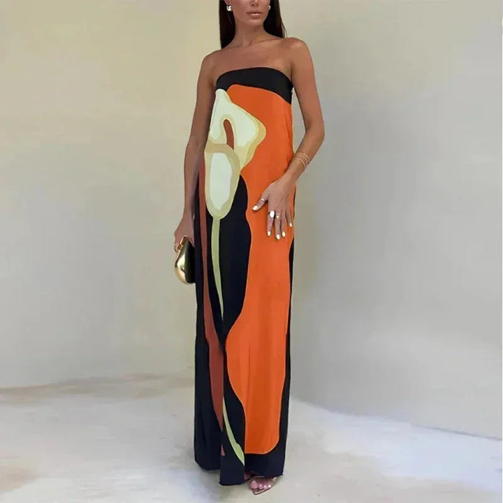 Robe longue orange femme bustier avec motifs abstraits, en tissu fluide pour un confort optimal et un style élégant.