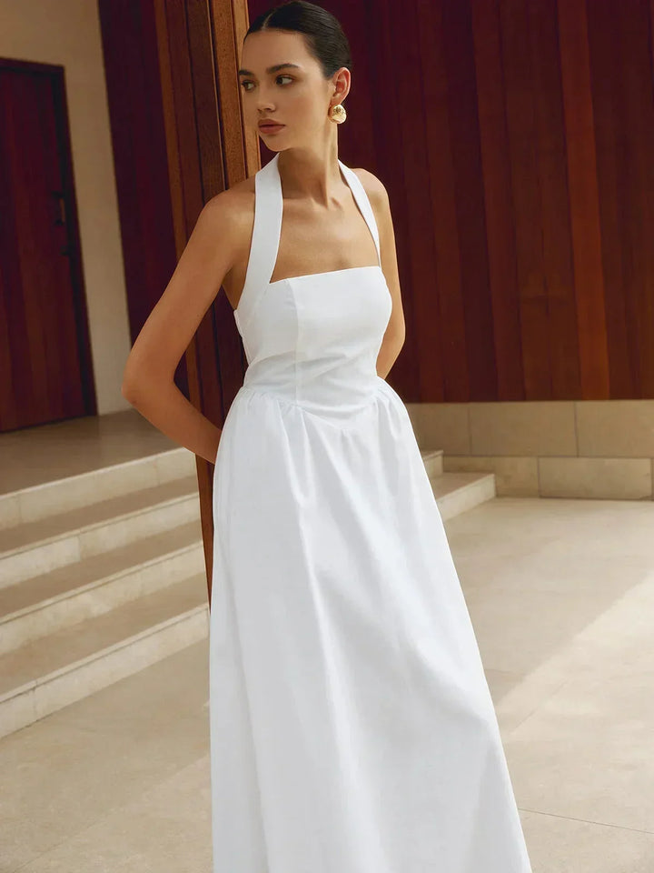 Robe longue femme en coton, col carré, avec poches intégrées pour un style pratique et élégant.