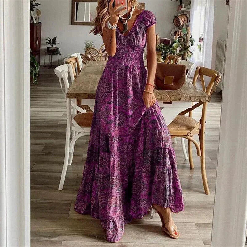 Robe longue violette en coton, décontractée, manches courtes, détails volants au bas pour un style léger et élégant.