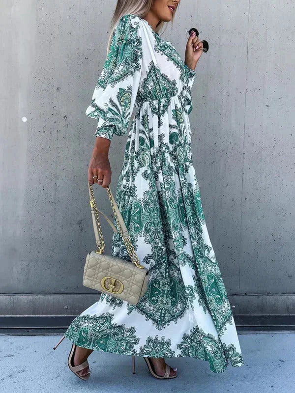 Robe longue femme en tissu léger, avec imprimé floral, fente haute et décolleté en V, parfaite pour les journées d'été.