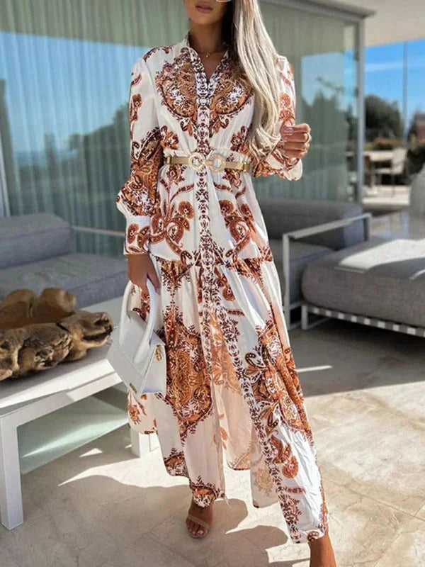 Robe longue femme orange, imprimée avec une fente haute et col V, en tissu léger et fluide, parfaite pour l'été.