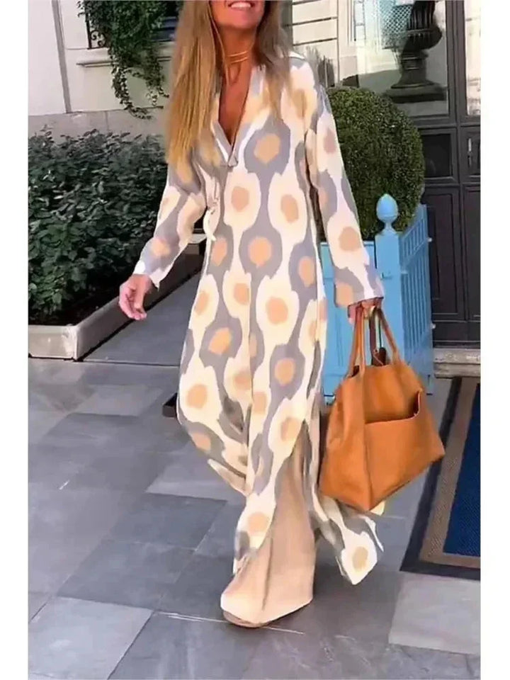 Robe longue femme en Abricot, manches longues, col V, tissu fluide à motifs, idéale pour une allure élégante et décontractée.