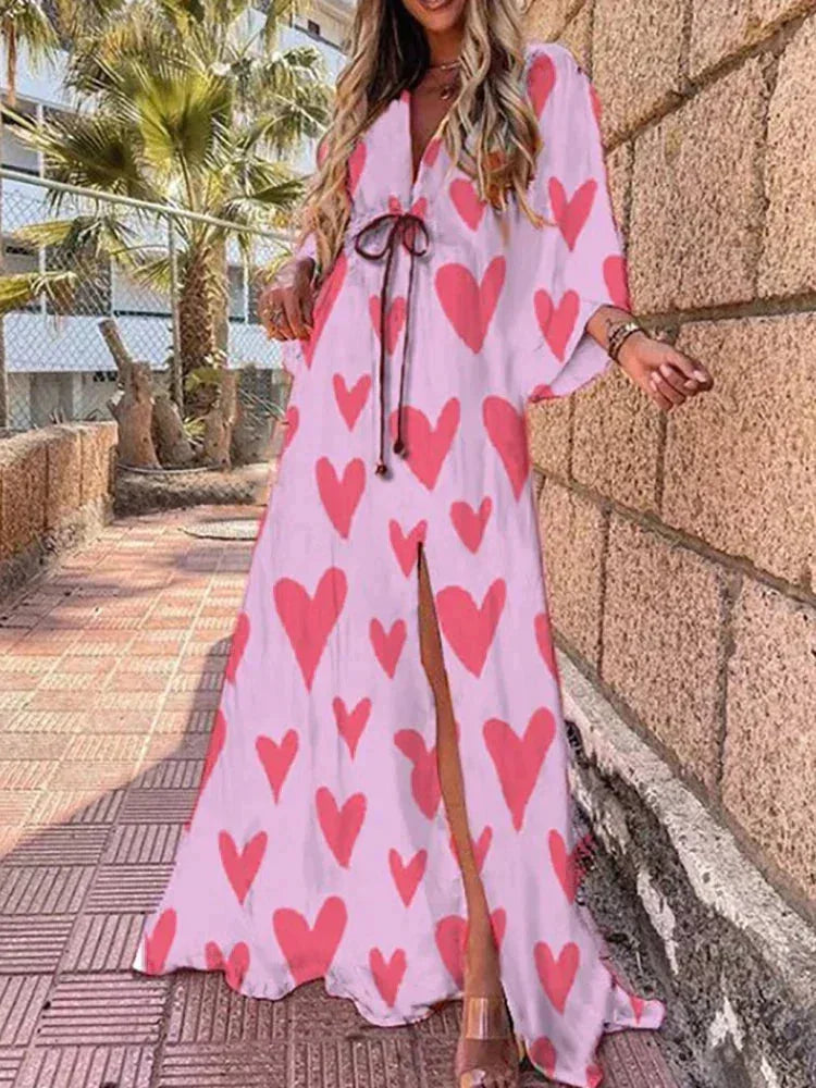 Robe longue rose à motifs, ceinture à la taille, manches longues, tissu léger et fluide, parfaite pour les occasions…