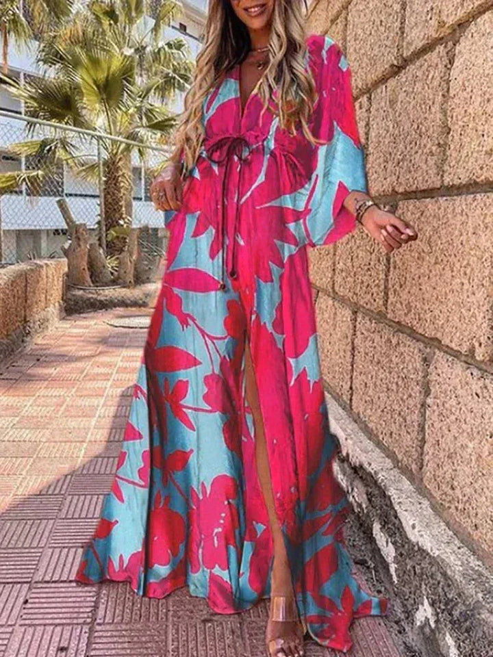Robe longue femme en polyester avec motifs floraux, ceinture marquée, manches longues, couleur rose et bleu.