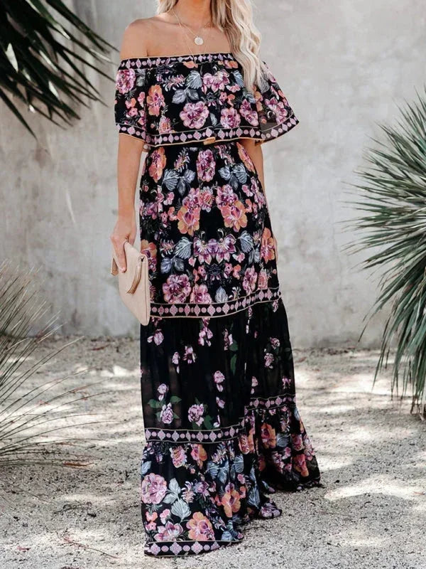 Robe longue pour femme, épaules dénudées, en tissu léger avec motifs floraux colorés et coupe fluide pour un confort optimal.