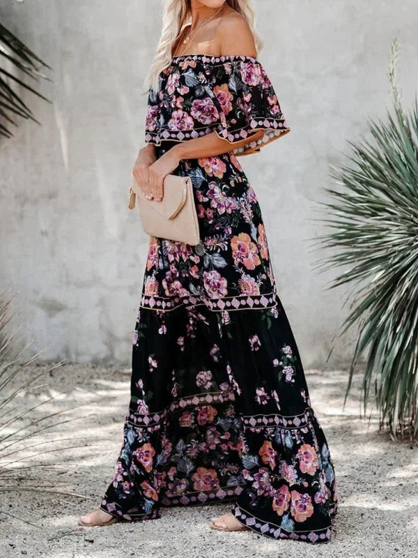 Robe longue femme à épaules dénudées, en coton léger, avec motifs floraux colorés et design fluide pour un look décontracté.