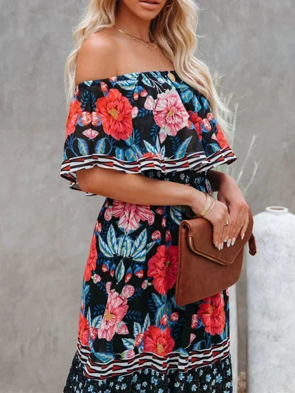 Robe longue femme à épaules dénudées, en tissu léger, avec motifs floraux colorés et coupe fluide pour un style décontracté.