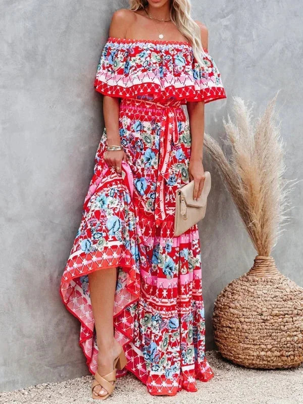 Robe longue à épaules dénudées en coton, ornée de motifs floraux colorés pour un look printanier et décontracté.