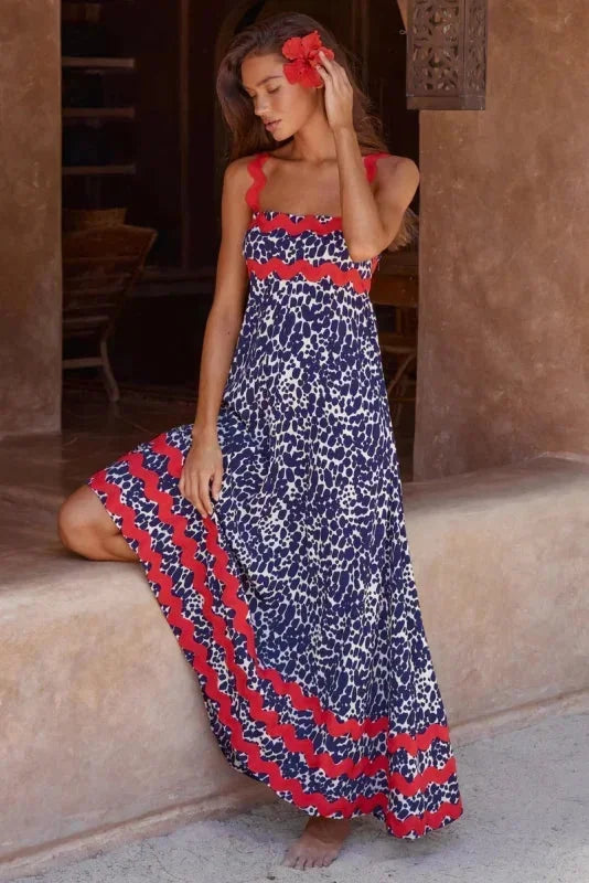 Robe longue femme sans manches en marine, avec un bord ondulé et une coupe fluide pour un look décontracté et élégant.