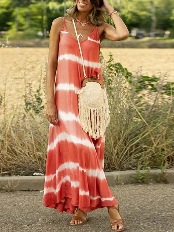 Robe longue sans manches en tissu léger tie-dye, col en V, offrant une coupe ample et confortable pour les journées d'été.