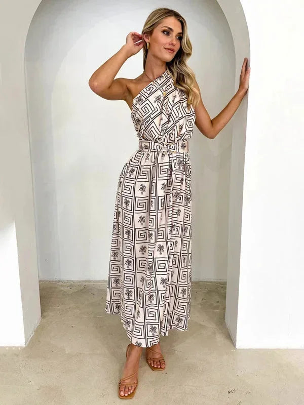 Robe longue femme à une épaule, en tissu léger, ceinture incluse, idéale pour les occasions formelles ou décontractées.