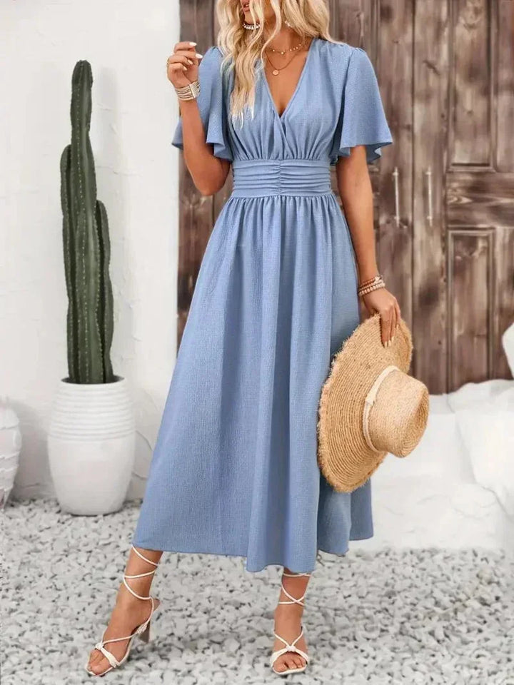 Robe longue femme avec volants, col V, en tissu léger, dotée d'une ceinture ajustable pour un ajustement parfait.
