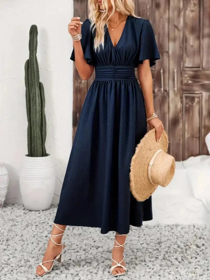 Robe longue pour femme en tissu léger, avec volants, col V et ceinture ajustable pour un ajustement personnalisé.