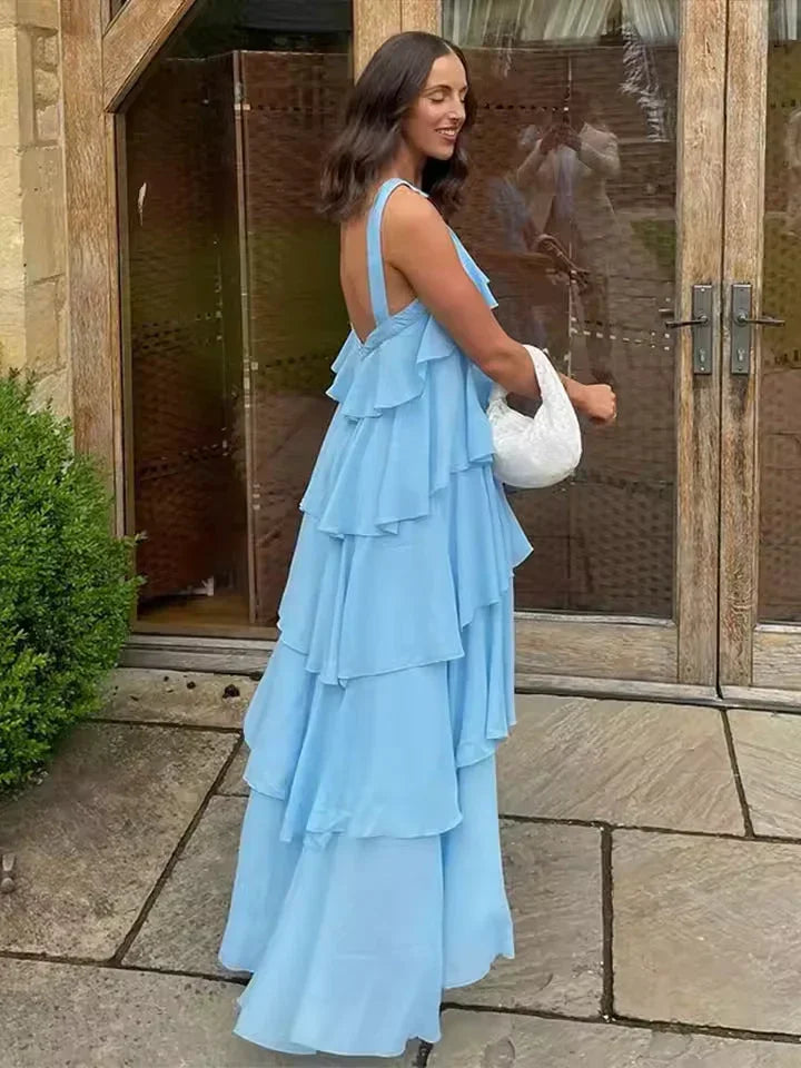Robe longue femme à volants nouée en coton léger, avec des volants fluides et une taille ajustable par un nœud.