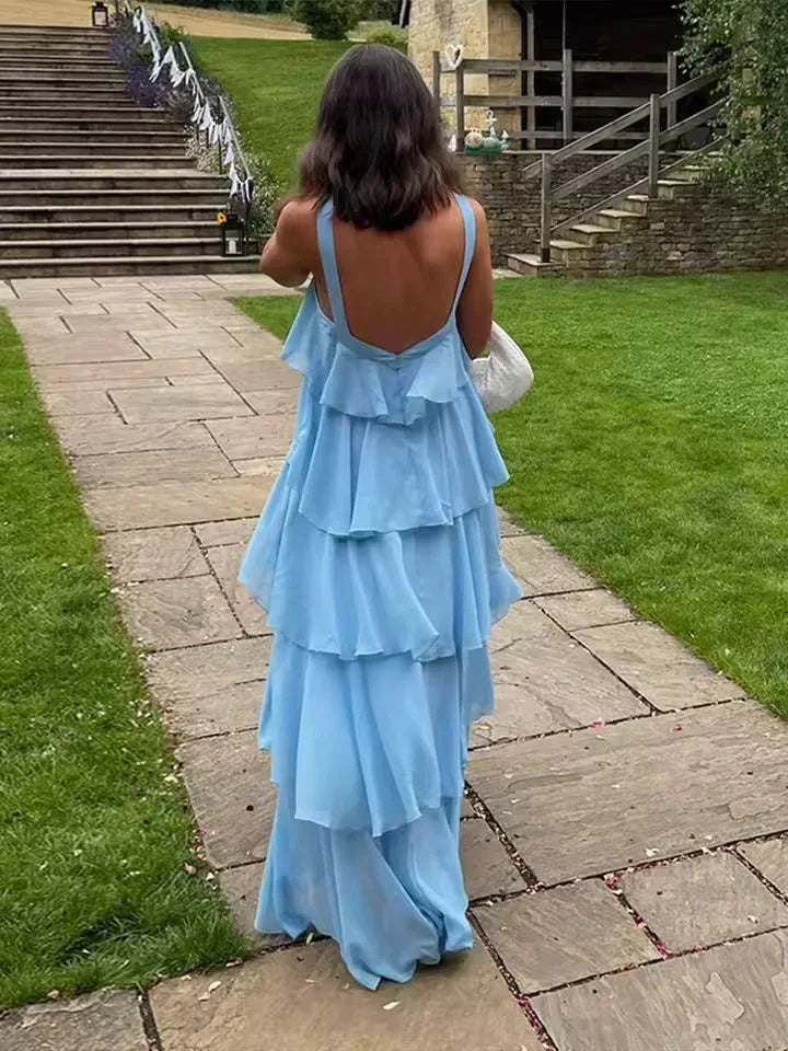Robe longue femme à volants, en coton léger, avec des manches nouées et un motif floral délicat.