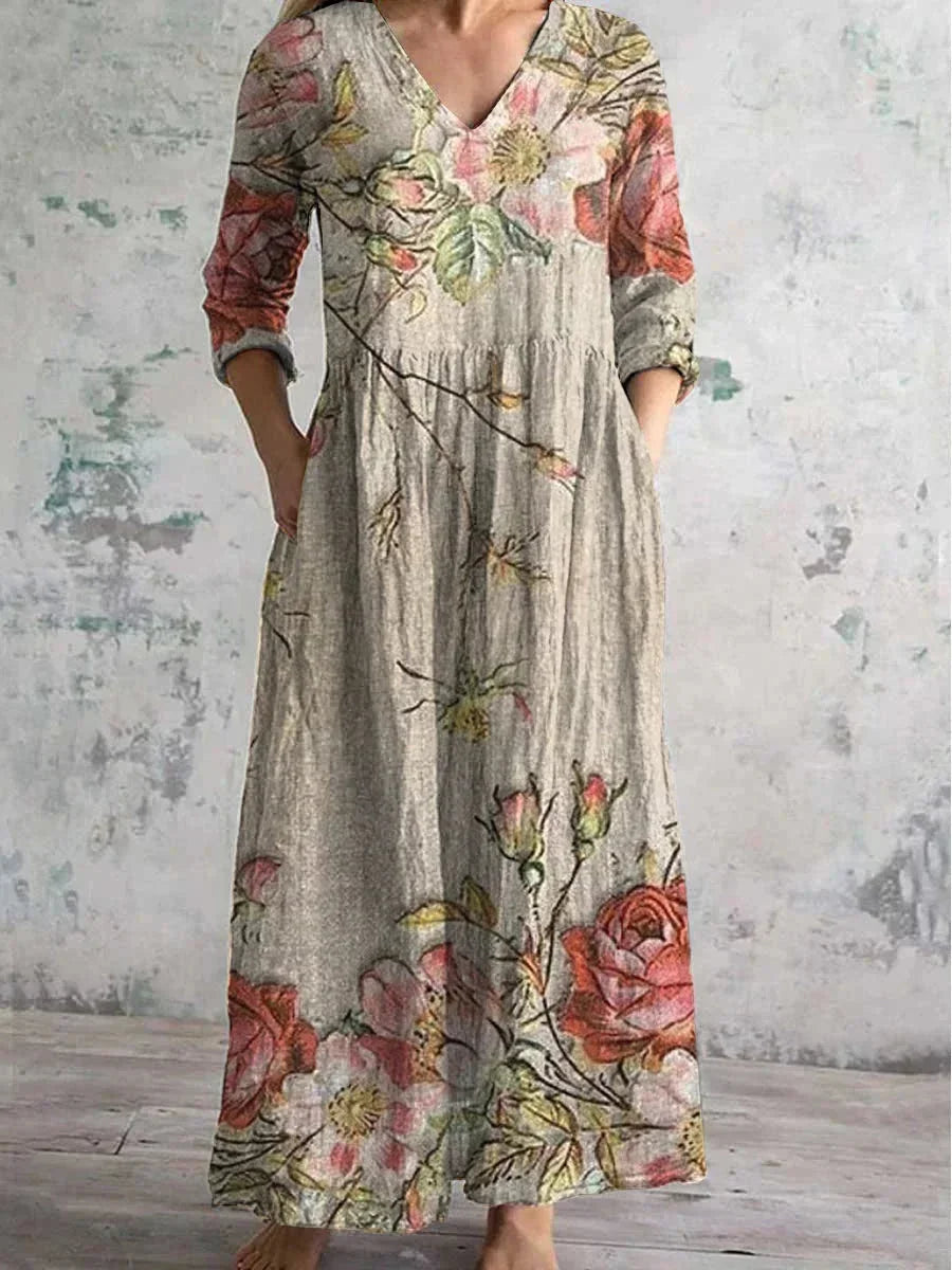 Robe longue à imprimé floral, col en V, manches 3/4, en coton léger, idéale pour les journées ensoleillées.