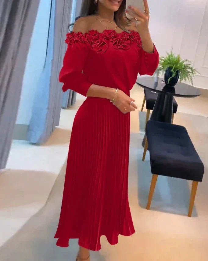 Robe longue rouge à épaules dénudées, volants floraux, jupe plissée en tissu léger, idéale pour les soirées printanières.