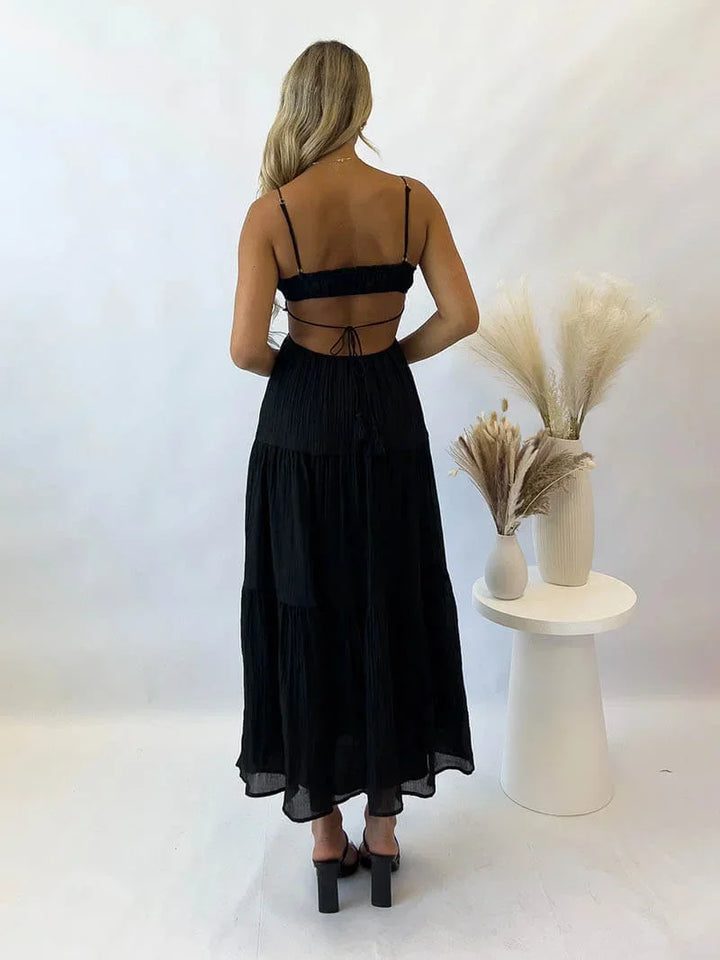 Robe longue à volants, tissu léger, cordon ajustable, bretelles fines, parfaite pour une tenue d'été décontractée.