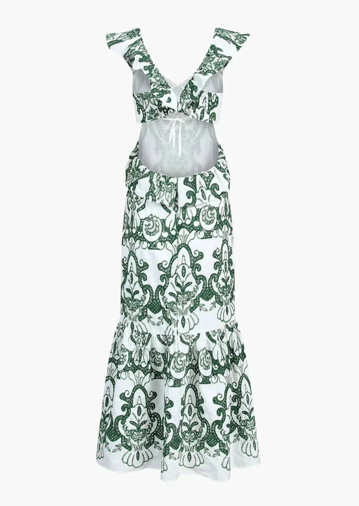 Robe longue blanche et verte à volants, en coton léger, avec un dos noué pour un style estival décontracté.