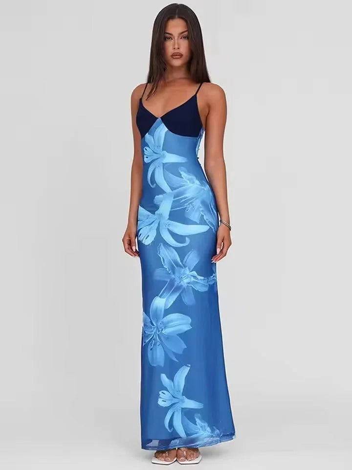 Robe maxi femme en coton léger, imprimé floral coloré, bretelles fines et coupe fluide pour un style décontracté.
