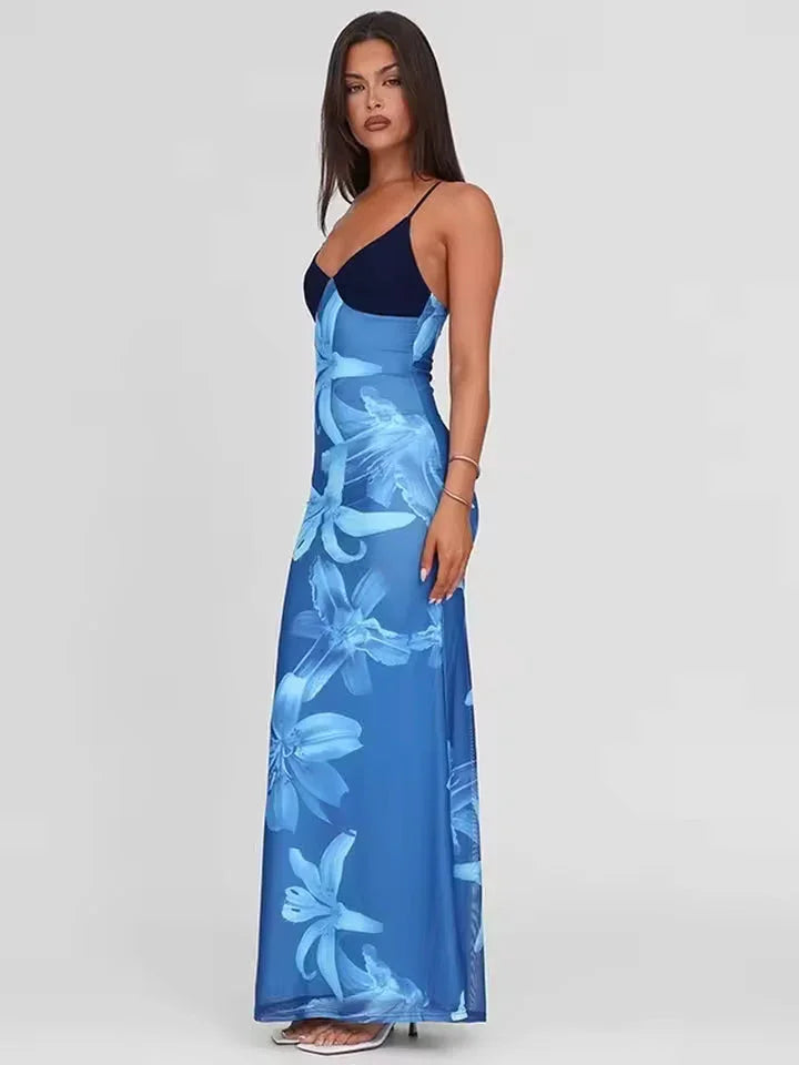Robe maxi femme en coton, imprimé floral vibrant, bretelles fines pour un style décontracté et agréable à porter.