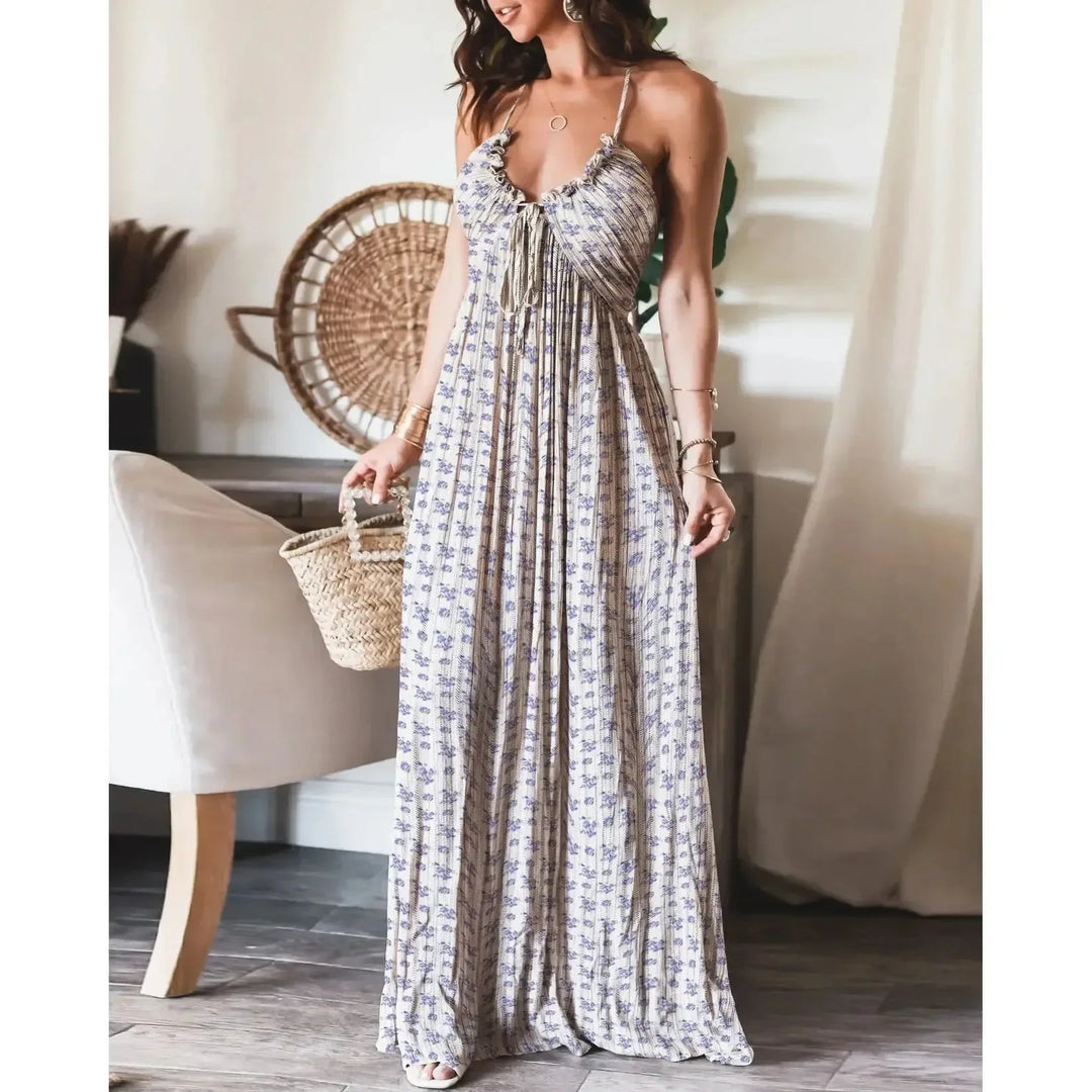 Robe maxi femme en tissu fluide, avec bretelles, motif de fleurs blanches sur fond clair, idéale pour les occasions…