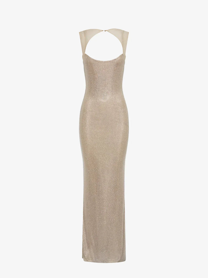 Robe maxi femme en tissu argenté, dos nu avec sequins brillants, parfaite pour une occasion spéciale.