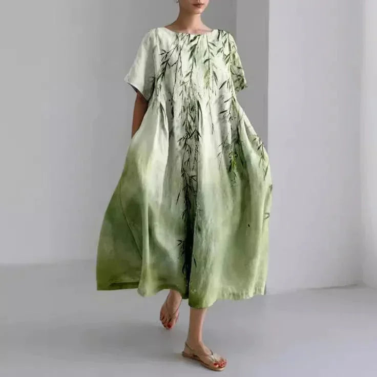 Robe maxi femme en bambou, floral, ample, avec manches courtes et poches pratiques, parfaite pour un look décontracté.