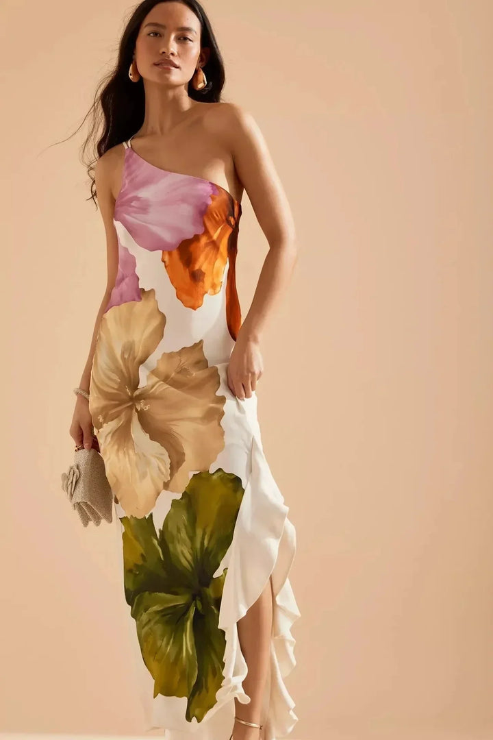 Robe maxi femme à imprimé floral multicolore, en tissu léger, avec bretelles fines et coupe fluide parfaite pour l'été.