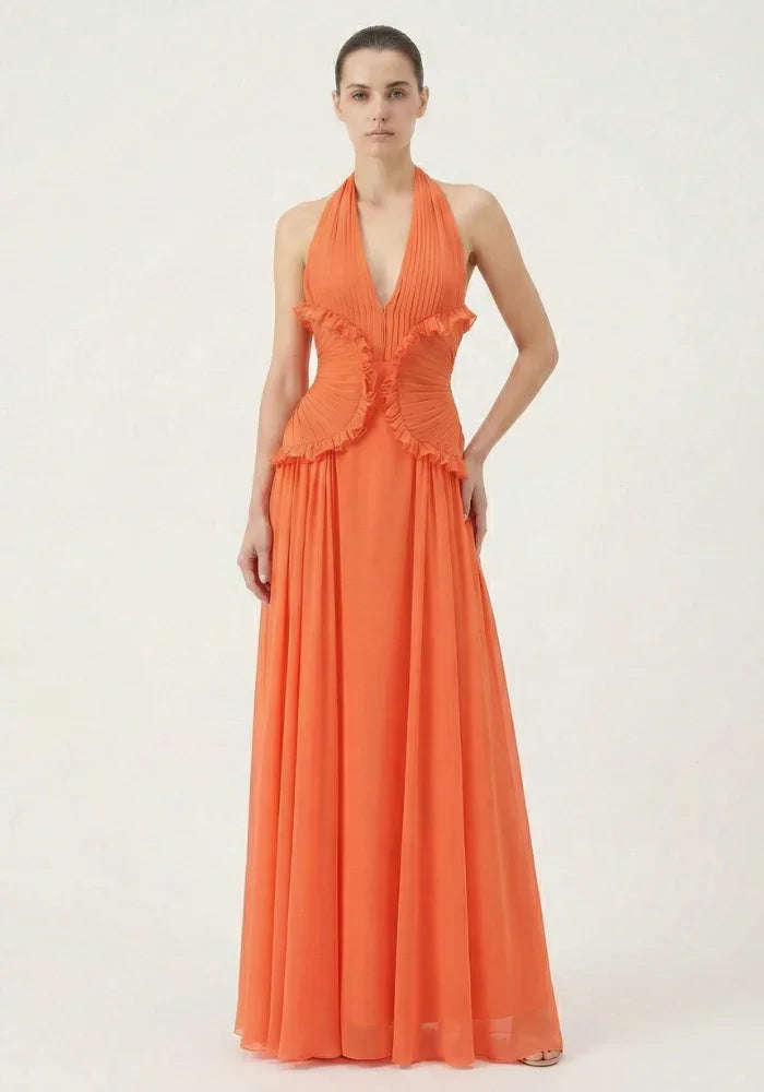 Robe maxi femme orange en coton léger avec volants, idéale pour les journées ensoleillées et les sorties décontractées.