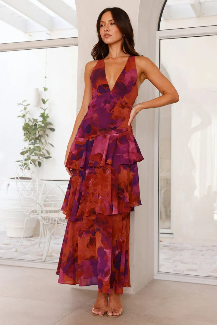Robe maxi femme sans manches en coton, avec volants et imprimé floral, idéale pour les journées d'été.