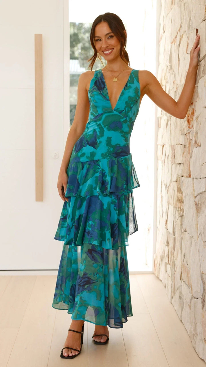 Robe maxi femme sans manches, en coton léger, avec volants et imprimés floraux colorés pour un look décontracté.