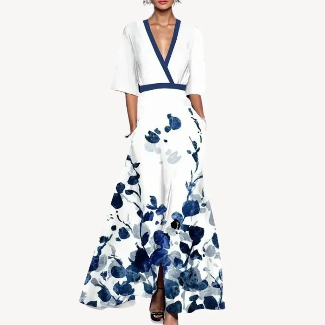 Robe longue fluide à manches mi-longues, bordure contrastée, en tissu léger avec poches pratiques et coupe décontractée.
