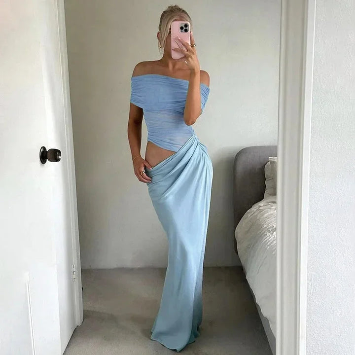 Robe longue en tissu fluide, épaules dénudées, taille froncée avec découpe, parfaite pour des occasions décontractées.