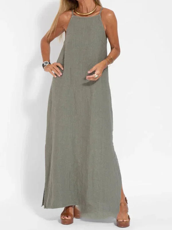Robe longue sans manches en tissu léger, coupe fluide, idéale pour un look décontracté en été. Associe confort et style.