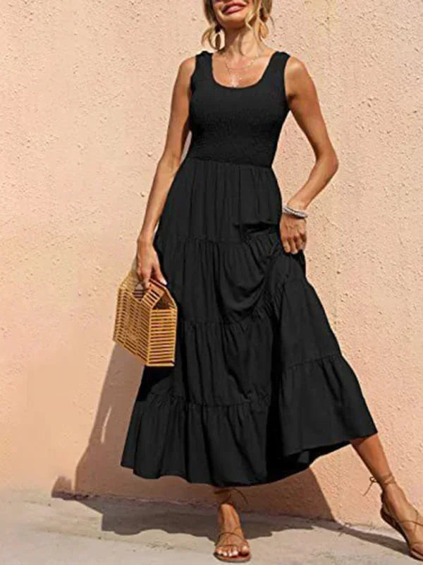 Robe longue sans manches en coton, avec smocks et volants, idéale pour les journées estivales. Disponible en plusieurs…