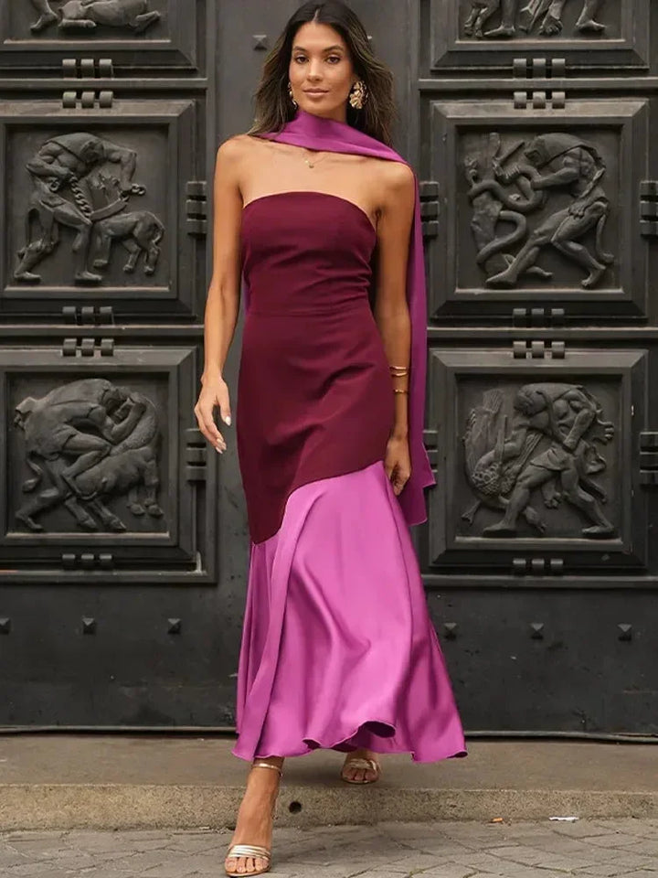 Robe midi sans manches en tissu fluide, design asymétrique bordeaux et rose avec col droit, idéale pour une soirée.
