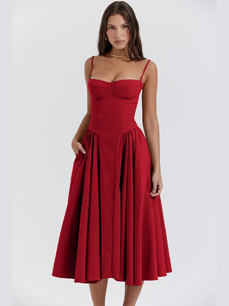 Robe midi avec bodice ajusté et jupe évasée, en tissu léger, bretelles fines pour une silhouette élégante.