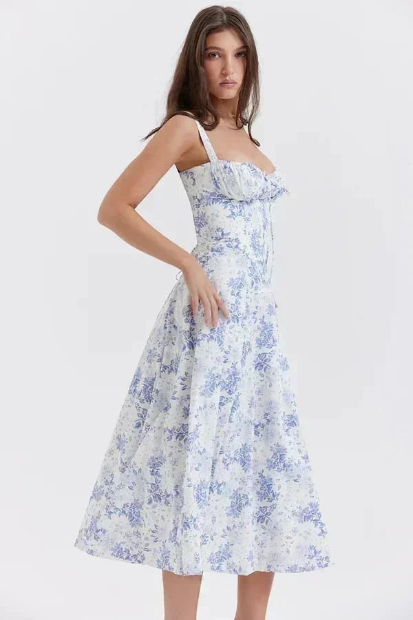 Robe midi femme avec corsage froncé, en coton doux, manches courtes et imprimé floral délicat, idéale pour le printemps.