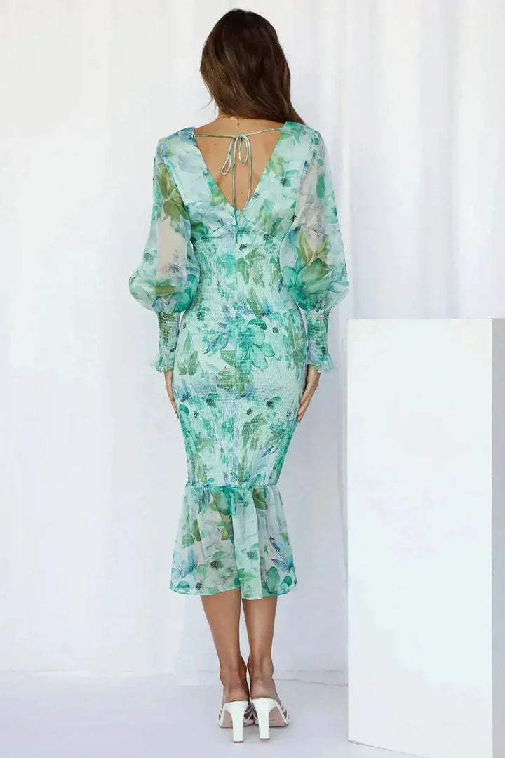 Robe midi femme à fleurs, fluide, manches longues, col en V et ourlet évasé, en tissu léger adapté pour le printemps.
