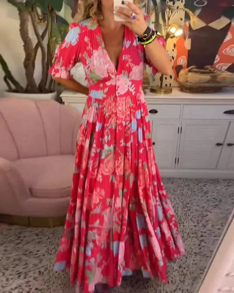 Robe midi femme à motifs floraux, en coton léger, manches courtes et coupe évasée pour plus de confort et de style.