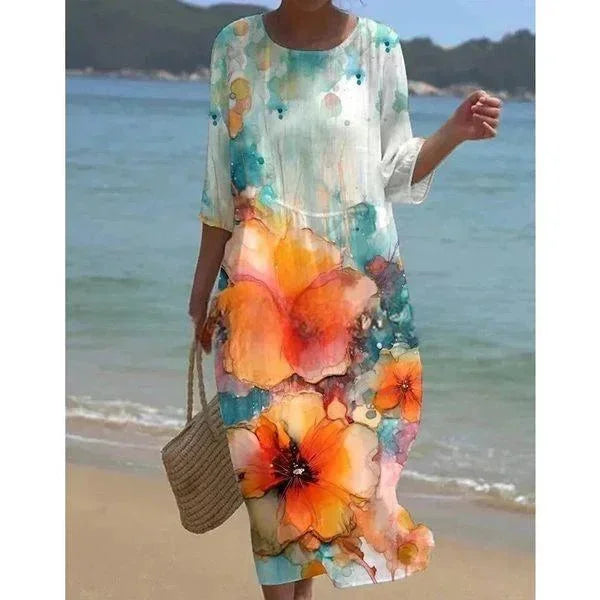 Robe midi femme en coton, motifs floraux colorés, manches mi-longues, idéale pour la plage et les journées ensoleillées.