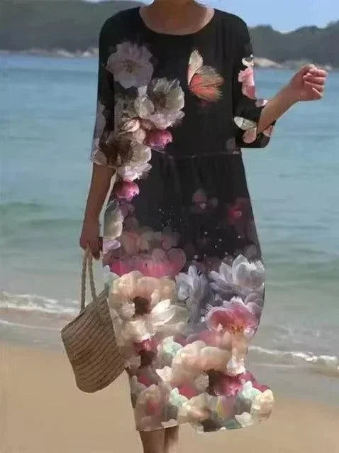 Robe midi noire pour femme, motifs variés, manches mi-longues, légère et idéale pour les sorties à la plage.