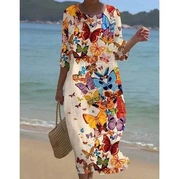 Robe midi femme avec motifs variés, manches mi-longues, tissu léger idéal pour la plage, coloris Papillons.