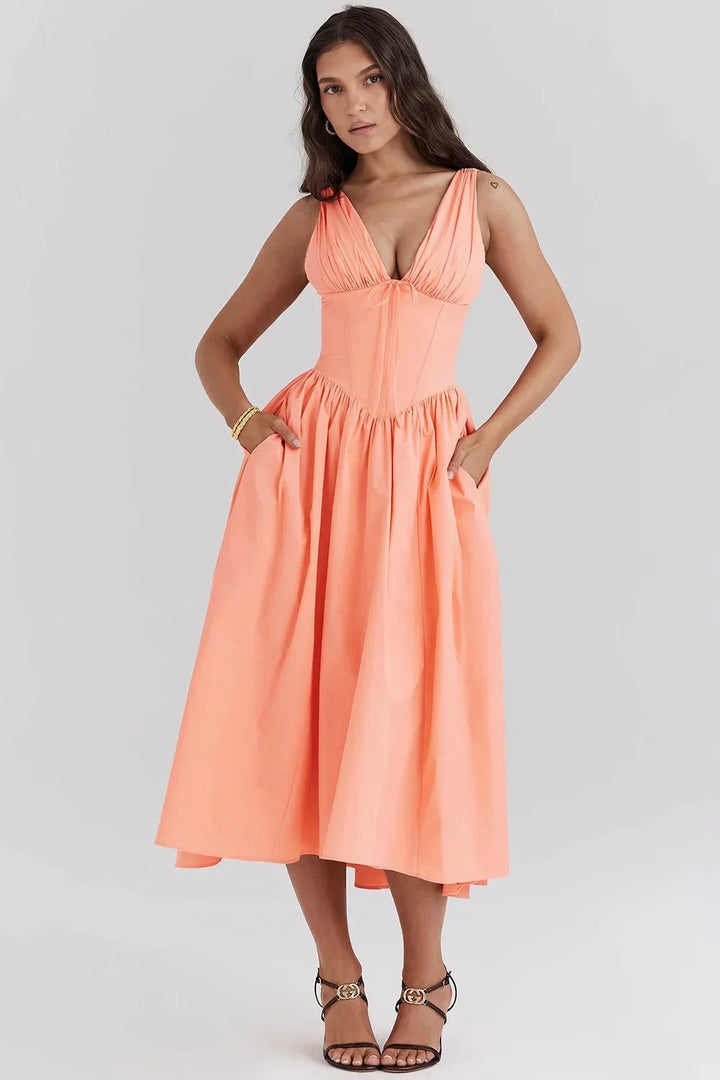 Robe midi florale évasée en coton léger, col en V, avec corset ajusté, disponible en plusieurs couleurs pour l'été.