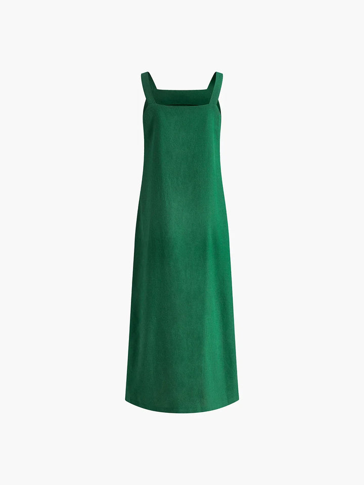 Robe midi sans manches en tissu léger, fente latérale et coupe ample, idéale pour les journées d'été.