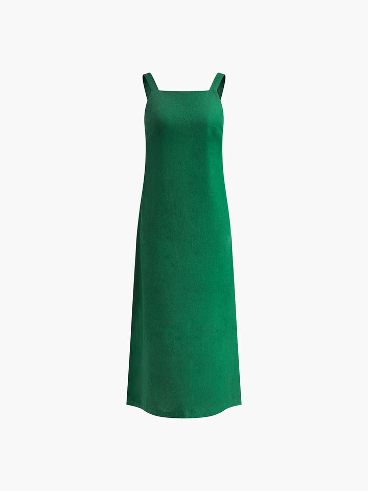 Robe midi sans manches en tissu léger, coupe ample avec fente latérale, idéale pour les journées d'été.