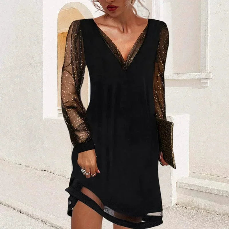 Robe courte col V avec manches transparentes, tissu léger et fluide, idéale pour les soirées et les fêtes.