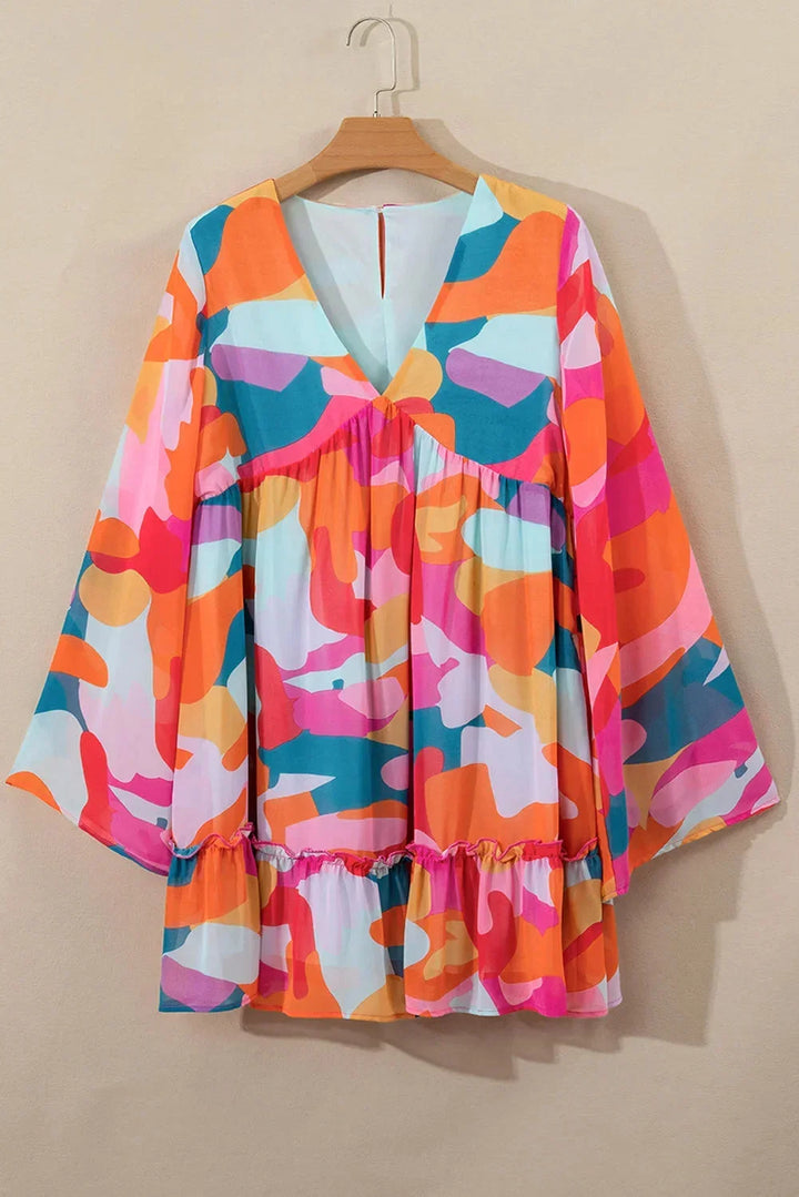 Robe courte à imprimé coloré, décolleté en V, manches longues, légère et idéale pour l'été à la plage.