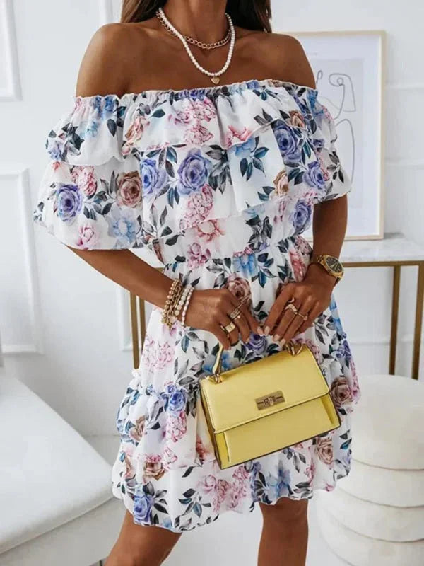 Robe courte à volants, imprimée de fleurs, épaules dénudées, en tissu léger et fluide, parfaite pour l'été.